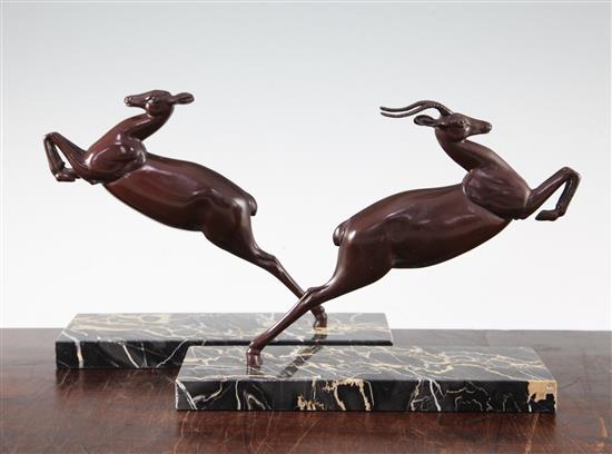 A pair of Art Deco patinated metal bookends, 11in.